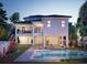 Two-story house with a pool and a landscaped backyard at 625 80Th Ave, St Pete Beach, FL 33706