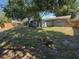 Expansive backyard with lush grass and mature trees at 10911 Oldham Rd, Port Richey, FL 34668