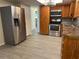 Modern kitchen with stainless steel appliances and wood cabinets at 10911 Oldham Rd, Port Richey, FL 34668