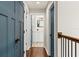 Bright hallway with navy blue doors leading to bedrooms and bathroom at 2820 N Central Ct, Tampa, FL 33602