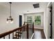 Upper hallway with dark wood flooring and a chandelier at 2820 N Central Ct, Tampa, FL 33602