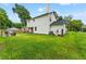 White two-story house with a spacious lawn and detached garage at 2820 N Central Ct, Tampa, FL 33602