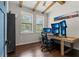 Home office with hardwood floors, multiple monitors, and built-in shelving at 2820 N Central Ct, Tampa, FL 33602