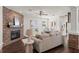 Living room boasts a brick fireplace and ample natural light at 2820 N Central Ct, Tampa, FL 33602