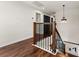 Upper level hallway with dark wood floors and black accents at 2820 N Central Ct, Tampa, FL 33602
