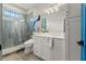 Modern bathroom with a walk-in shower, double vanity, and elegant fixtures at 2820 N Central Ct, Tampa, FL 33602