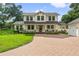 Two-story house with a brick walkway and attached garage at 2820 N Central Ct, Tampa, FL 33602