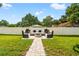 Landscaped backyard with a firepit and comfortable seating area at 2820 N Central Ct, Tampa, FL 33602