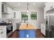 Modern kitchen with stainless steel appliances and a large kitchen island at 2820 N Central Ct, Tampa, FL 33602