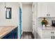 Hallway with blue door and white cabinets at 2820 N Central Ct, Tampa, FL 33602