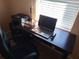 Home office with a desk, chair, printer, and window at 3118 Palm Ct, Dunedin, FL 34698