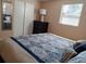 Bright bedroom with a dresser and a queen-size bed at 3118 Palm Ct, Dunedin, FL 34698