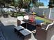 Outdoor patio with seating and a built-in grill at 3118 Palm Ct, Dunedin, FL 34698