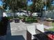 Outdoor patio area with fire pit, grill, and seating at 3118 Palm Ct, Dunedin, FL 34698