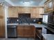Modern kitchen with stainless steel appliances and light wood cabinets at 3118 Palm Ct, Dunedin, FL 34698