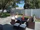 Outdoor patio area with seating and a grill at 3118 Palm Ct, Dunedin, FL 34698