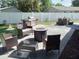 Outdoor patio with seating, fire pit, and grill at 3118 Palm Ct, Dunedin, FL 34698