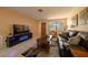 Comfortable living room with leather sofa and fireplace at 3118 Palm Ct, Dunedin, FL 34698