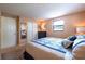 Bright bedroom with king-size bed and mirrored closet at 3118 Palm Ct, Dunedin, FL 34698