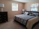 Spacious Primary bedroom with a king-size bed and two nightstands at 3118 Palm Ct, Dunedin, FL 34698