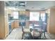 Updated kitchen features stainless steel appliances and light wood cabinets at 3118 Palm Ct, Dunedin, FL 34698