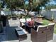 Outdoor patio with seating, fire pit, and built-in grill at 3118 Palm Ct, Dunedin, FL 34698