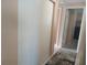 Bright hallway with neutral walls and carpet at 3118 Palm Ct, Dunedin, FL 34698