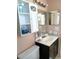 Nice bathroom with a vanity, toilet, and medicine cabinet at 3118 Palm Ct, Dunedin, FL 34698