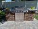 Outdoor kitchen with built-in grill and stone countertops at 3118 Palm Ct, Dunedin, FL 34698