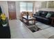 Living room with tiled floors and comfy seating at 3118 Palm Ct, Dunedin, FL 34698