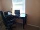 Functional home office featuring a desk, chair, and window at 3118 Palm Ct, Dunedin, FL 34698