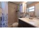 Bathroom with shower, toilet, vanity, and linen storage at 3118 Palm Ct, Dunedin, FL 34698