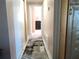 Hallway with carpet runner leading to bedrooms at 3118 Palm Ct, Dunedin, FL 34698