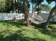 Relaxing backyard with hammock and swings at 3118 Palm Ct, Dunedin, FL 34698