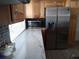 Stainless steel refrigerator and light colored countertops at 3118 Palm Ct, Dunedin, FL 34698