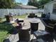 Outdoor patio with seating area and built-in grill at 3118 Palm Ct, Dunedin, FL 34698