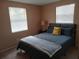 Comfortable bedroom featuring a full-size bed at 3118 Palm Ct, Dunedin, FL 34698