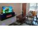 Living room with fireplace, TV, and comfy seating at 3118 Palm Ct, Dunedin, FL 34698