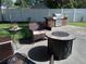 Outdoor patio with fire pit and built-in grill at 3118 Palm Ct, Dunedin, FL 34698