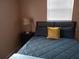 Charming bedroom with a full-size bed and nightstand at 3118 Palm Ct, Dunedin, FL 34698