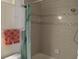 Bathroom with tub shower, and updated vanity at 3118 Palm Ct, Dunedin, FL 34698