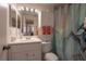 Clean bathroom with updated vanity and shower at 3118 Palm Ct, Dunedin, FL 34698