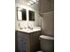 Bathroom with vanity, toilet, and updated lighting at 3118 Palm Ct, Dunedin, FL 34698