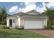 One-story home with two-car garage and attractive landscaping at 11298 Boundless Ter, Venice, FL 34293