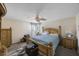 Bedroom with a king-size bed and ceiling fan at 1907 Sandpiper Dr, Clearwater, FL 33764