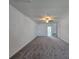 Large bedroom with plush carpet and ceiling fan at 7045 E 113Th Ct, Palmetto, FL 34221