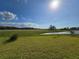 Large backyard with pond and open field at 7045 E 113Th Ct, Palmetto, FL 34221