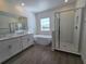 Elegant bathroom with soaking tub and walk-in shower at 7045 E 113Th Ct, Palmetto, FL 34221