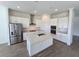 Modern kitchen with stainless steel appliances and island at 7045 E 113Th Ct, Palmetto, FL 34221