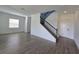 Bright entryway with staircase and wood-look tile flooring at 7045 E 113Th Ct, Palmetto, FL 34221
